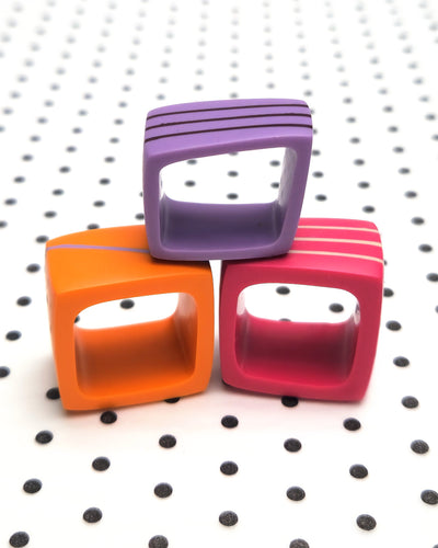 Kaz Robertson - Square ring (orange with lilac diagonal stripe)